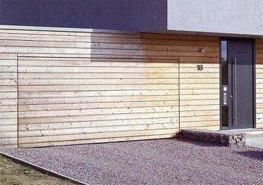 Photo of an onsite cladding of Hormann OFI up and over garage door. 